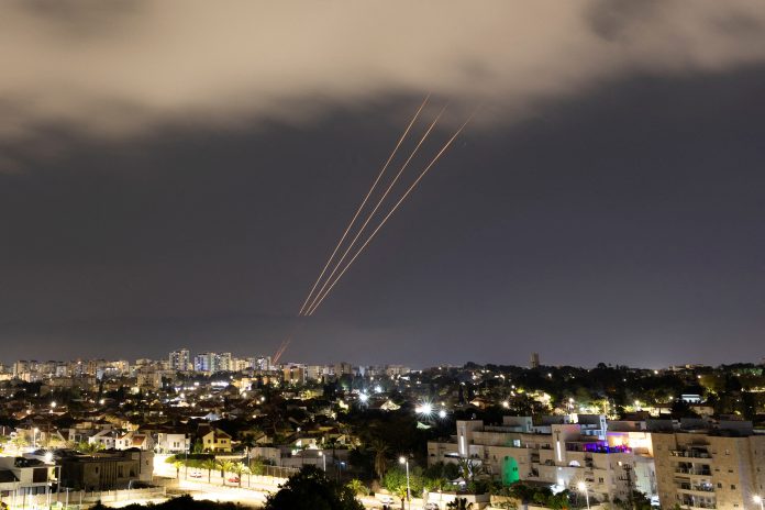 An anti-missile system operates after Iran launched drones and missiles towards Israel, as seen from Ashkelon